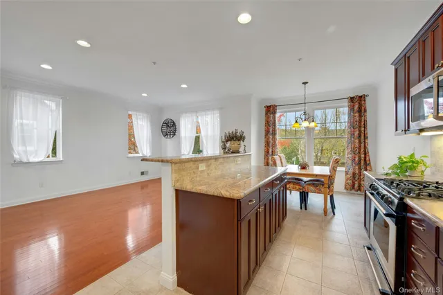 a kitchen with kitchen island granite countertop lots of counter top space