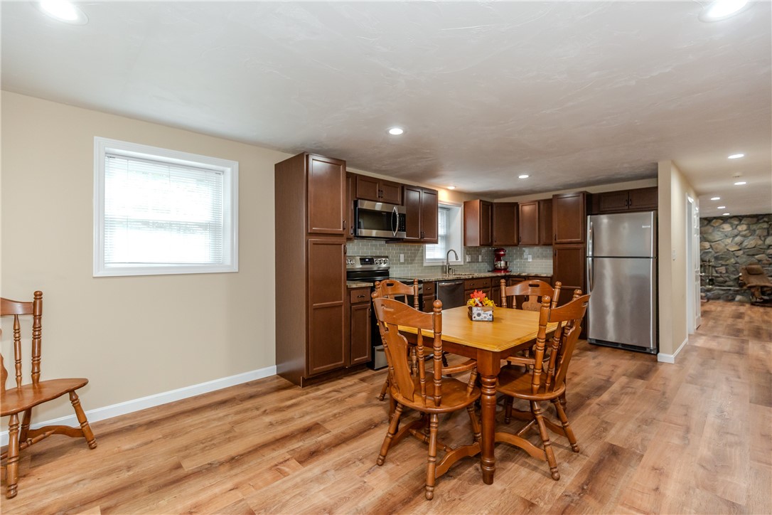 99 Tower Hill Road Cumberland, RI 02864 - Photo 27 of 43 Lower-level kitchen and dining area offering a convenient space for everyday meals and entertaining.