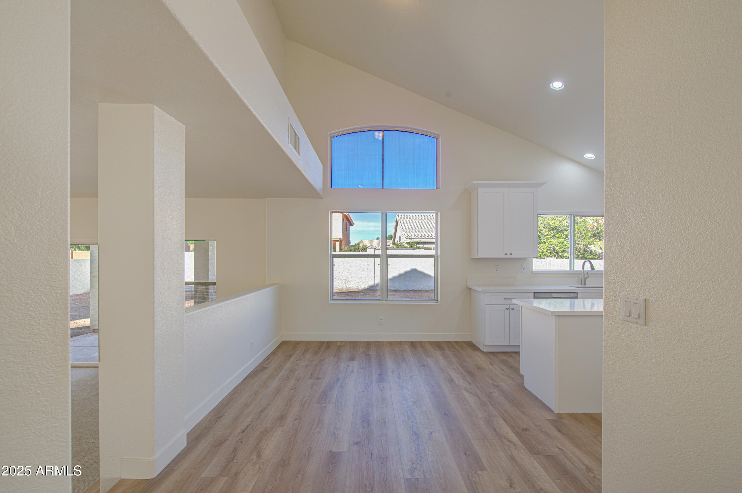 4266 East Millbrae Lane Gilbert, AZ 85234 - Photo 14 of 53 wooden floor in an empty room with a window