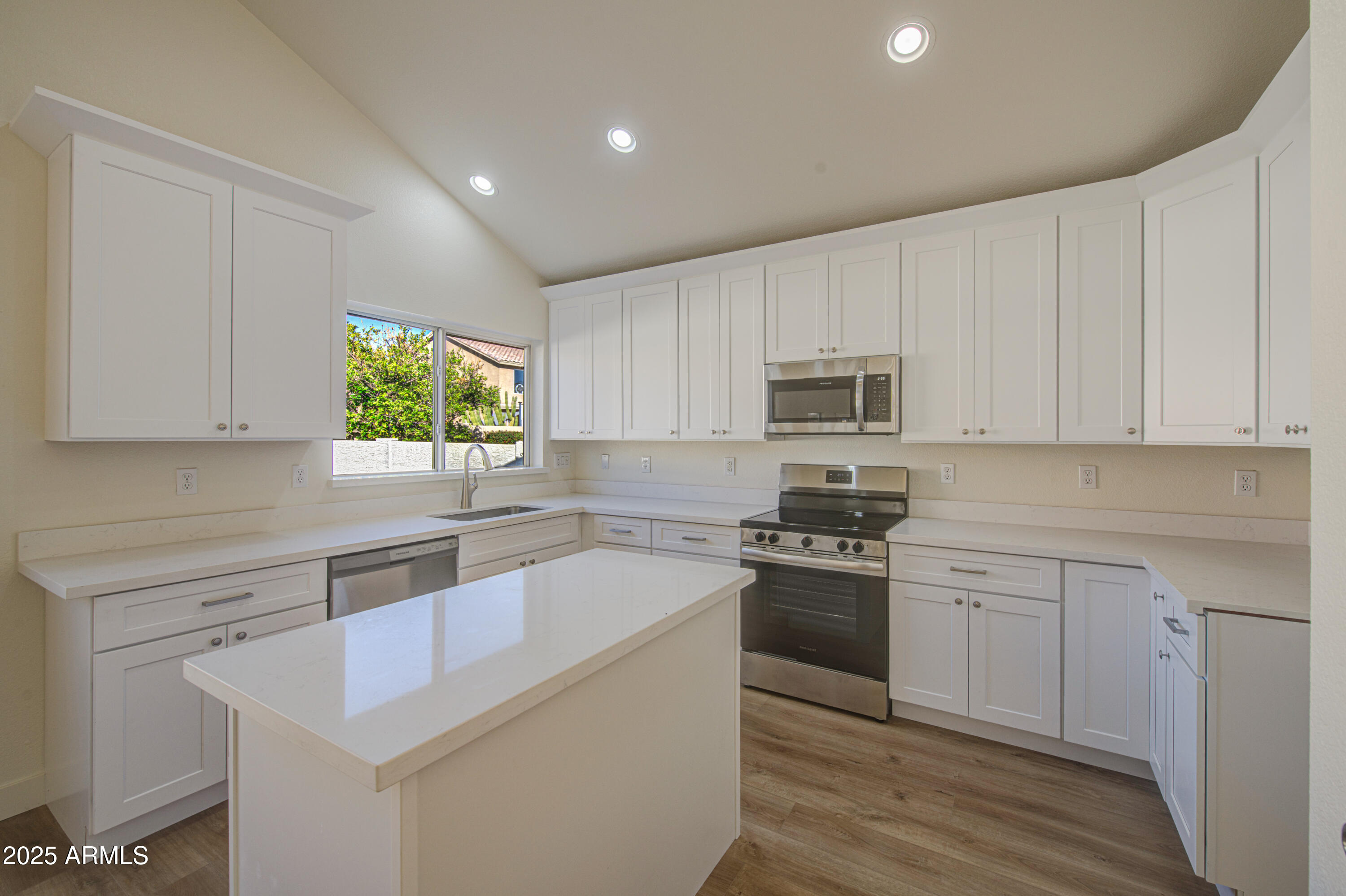 4266 East Millbrae Lane Gilbert, AZ 85234 - Photo 18 of 53 a kitchen with granite countertop white cabinets and white appliances