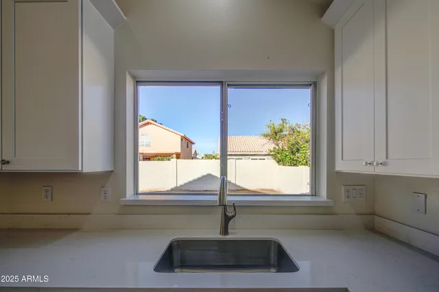 a kitchen with a sink and window