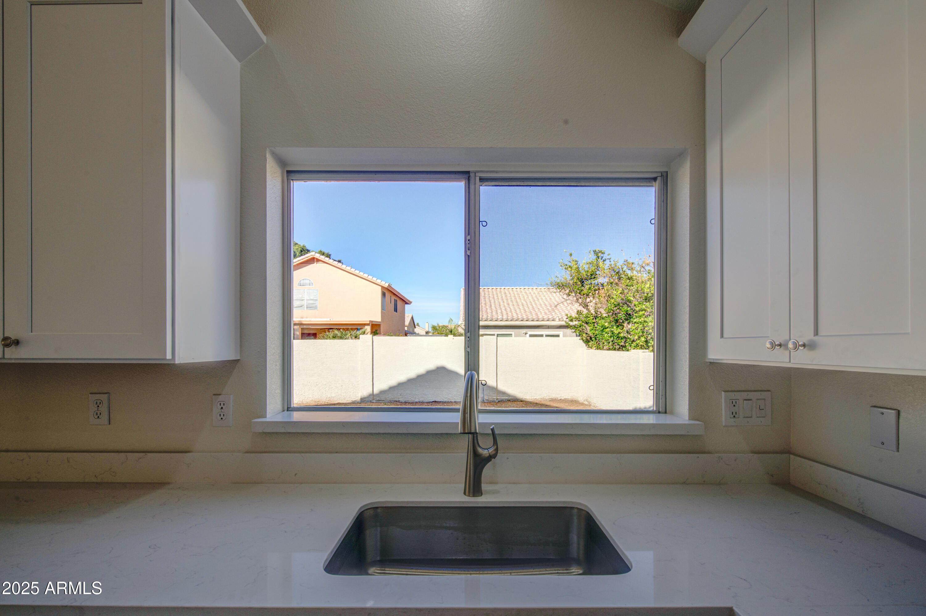 4266 East Millbrae Lane Gilbert, AZ 85234 - Photo 20 of 53 a kitchen with a sink and window