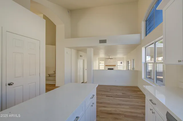 a view of kitchen and wooden floor
