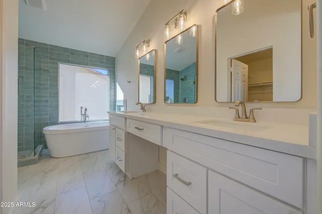 a bathroom with a bathtub and a shower