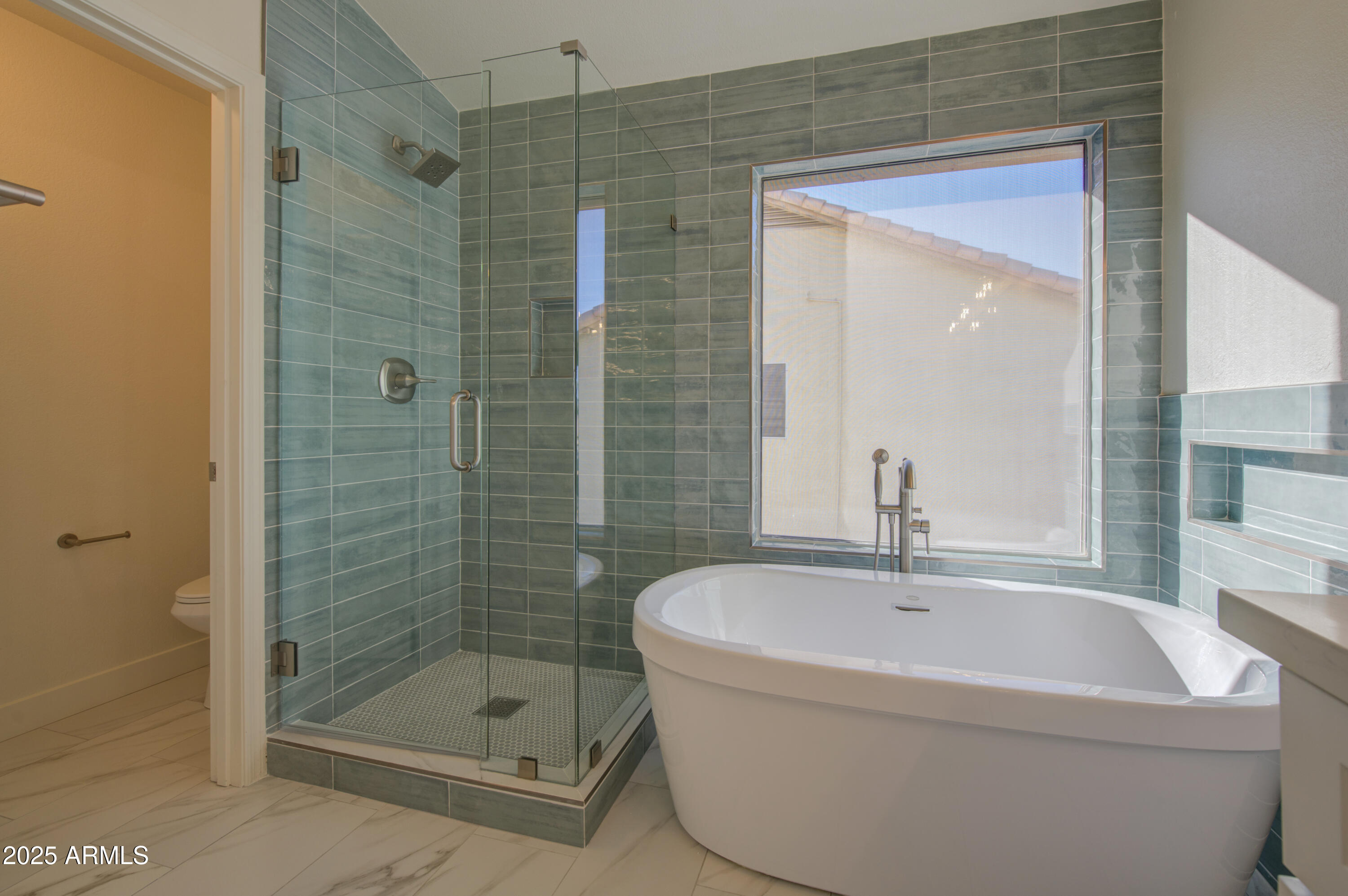 4266 East Millbrae Lane Gilbert, AZ 85234 - Photo 29 of 53 a bathroom with a bathtub and a shower