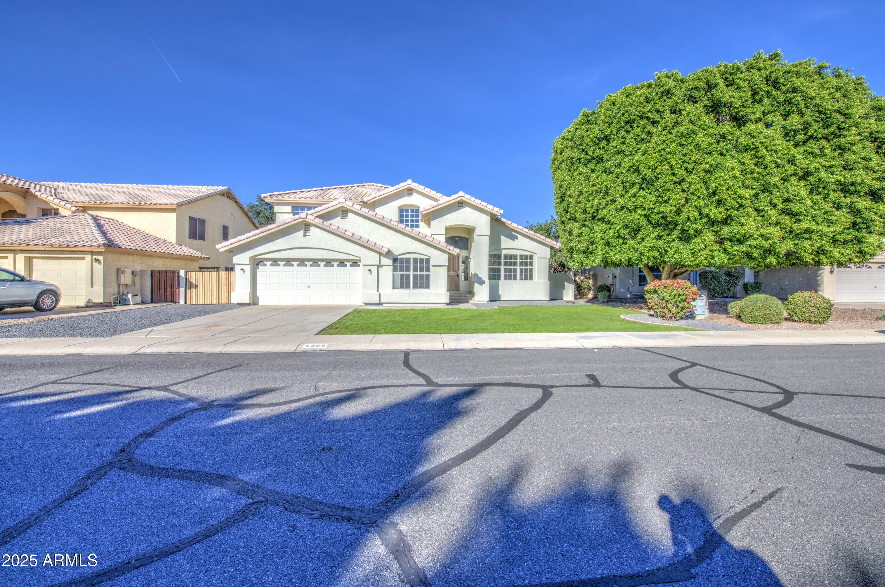4266 East Millbrae Lane Gilbert, AZ 85234 - Photo 3 of 53 a view of a house with a street