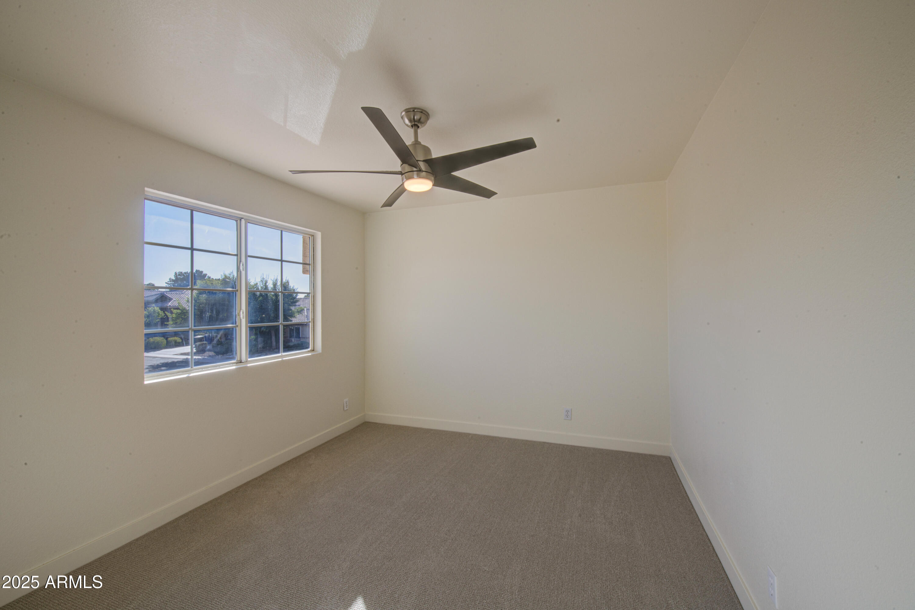 4266 East Millbrae Lane Gilbert, AZ 85234 - Photo 38 of 53 an empty room with a window