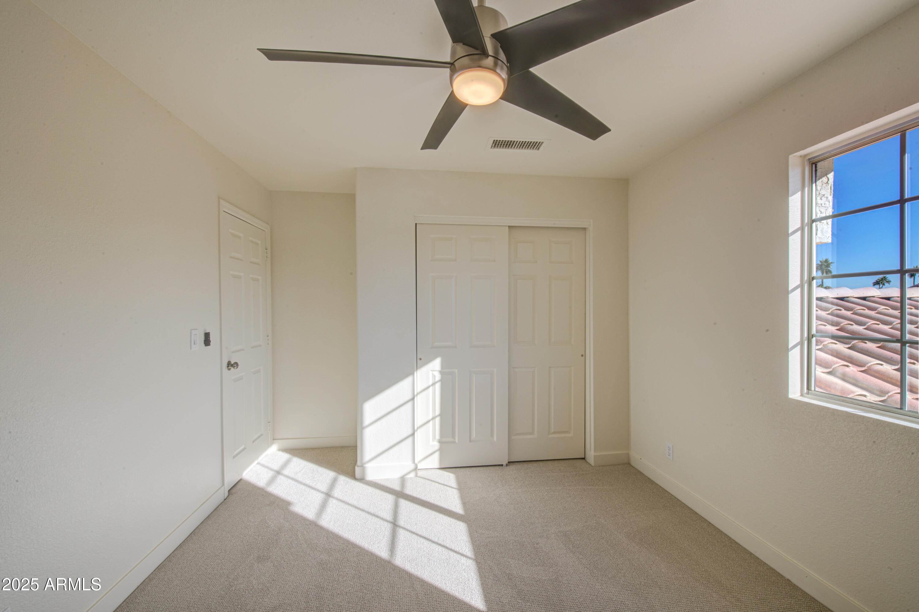 4266 East Millbrae Lane Gilbert, AZ 85234 - Photo 39 of 53 a view of an empty room with a window