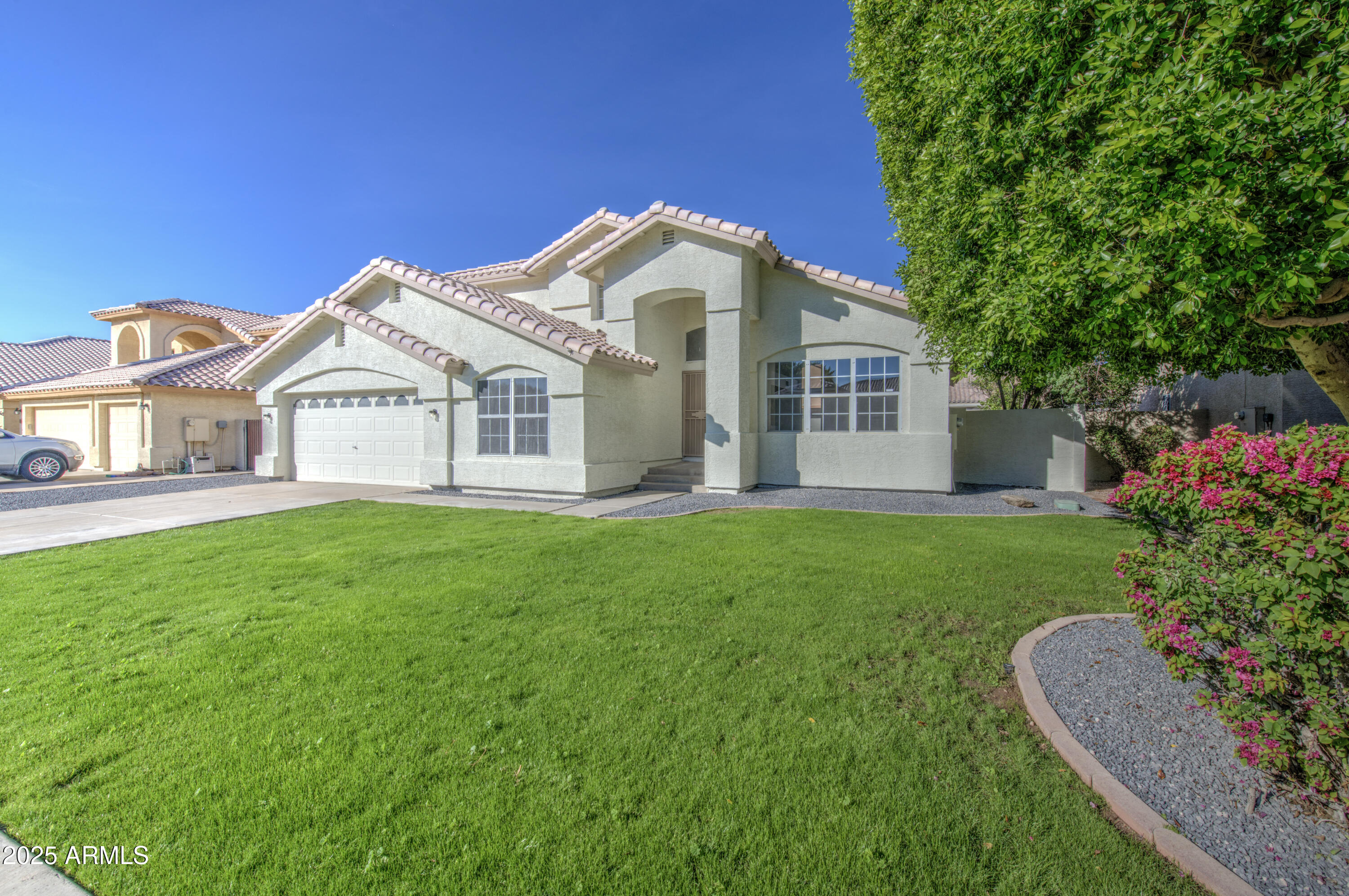 4266 East Millbrae Lane Gilbert, AZ 85234 - Photo 4 of 53 a view of a house with a garden
