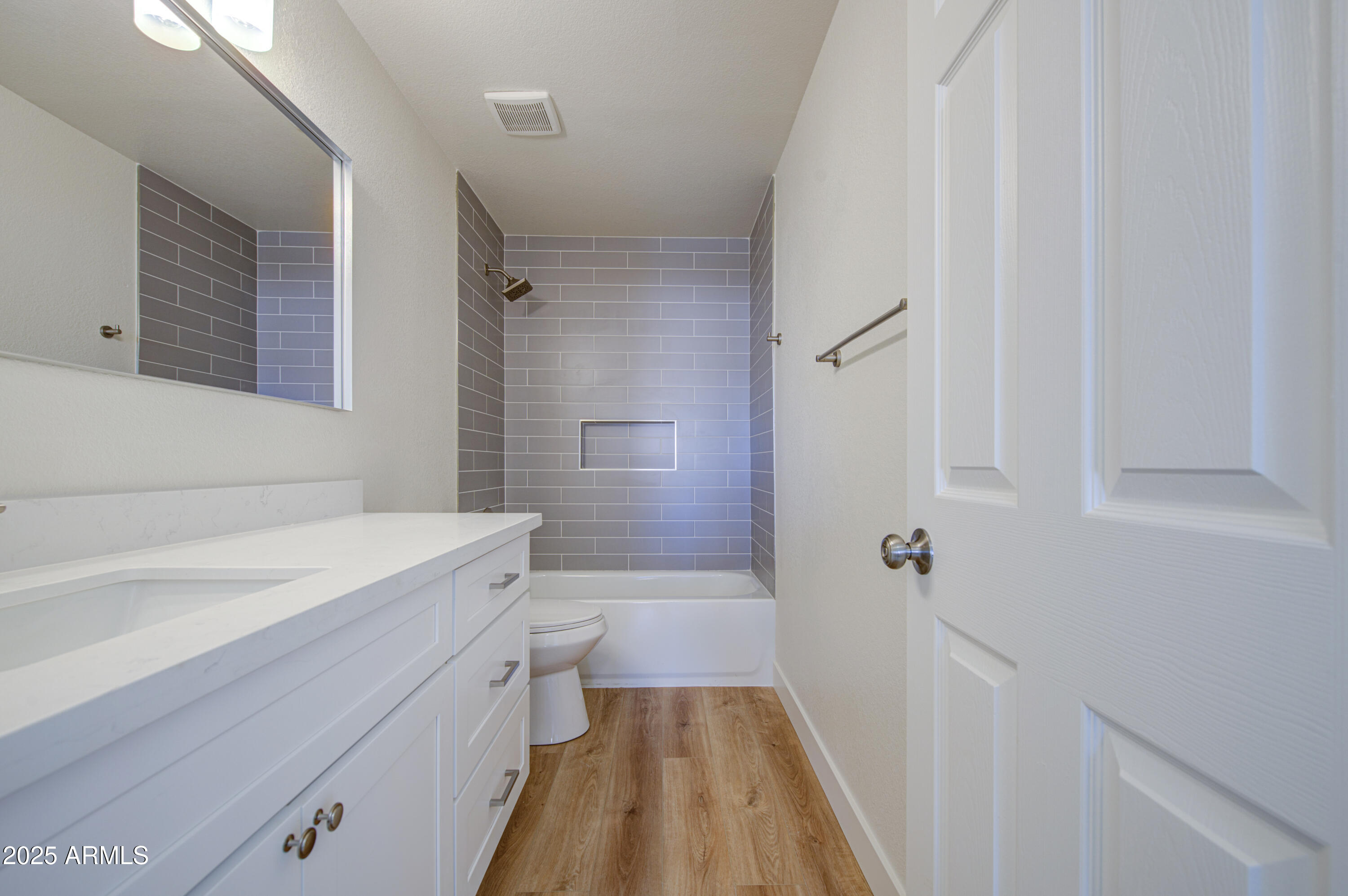4266 East Millbrae Lane Gilbert, AZ 85234 - Photo 44 of 53 a bathroom with a sink a toilet a shower and a mirror