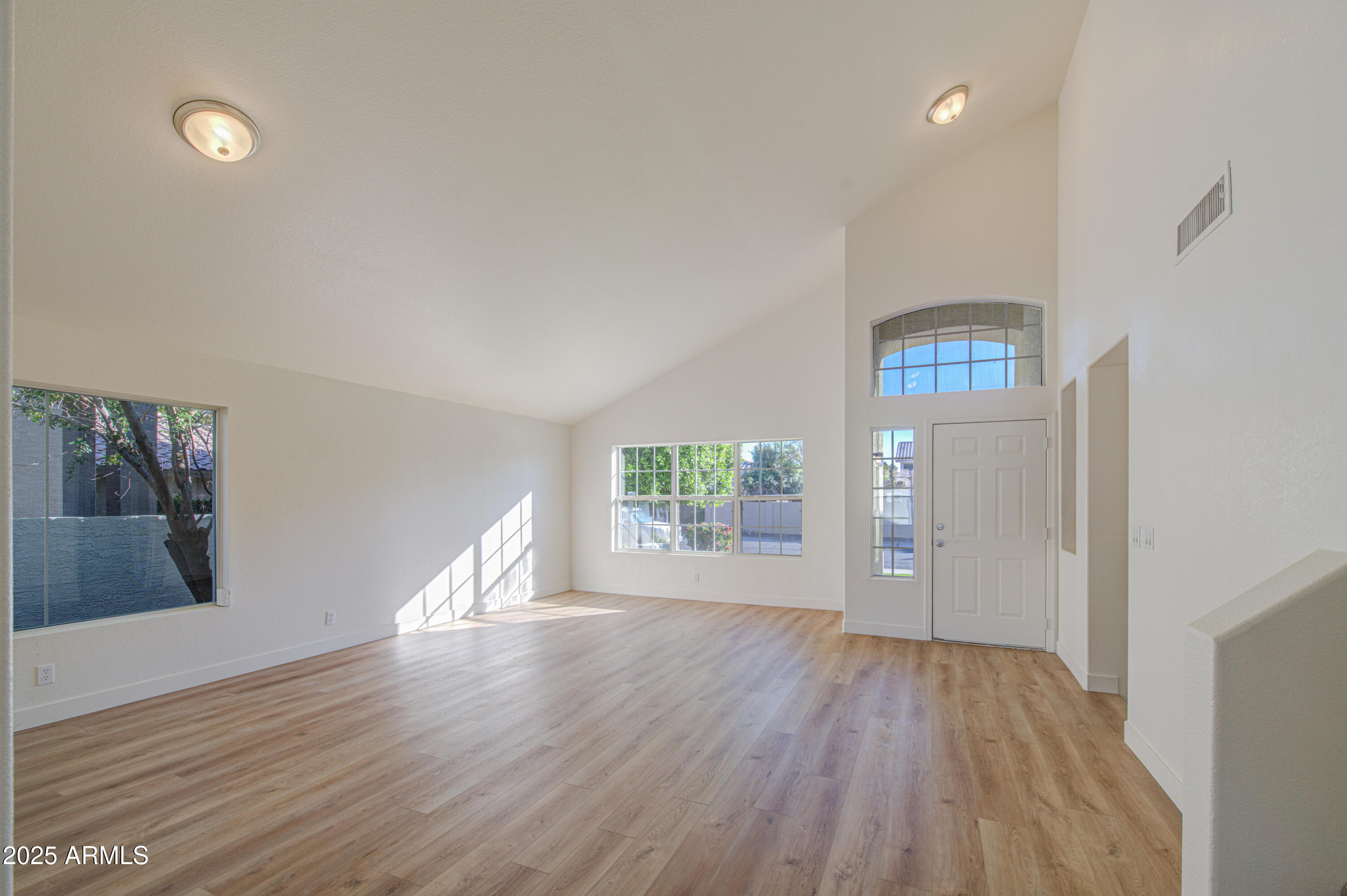 4266 East Millbrae Lane Gilbert, AZ 85234 - Photo 5 of 53 wooden floor in an empty room with a window