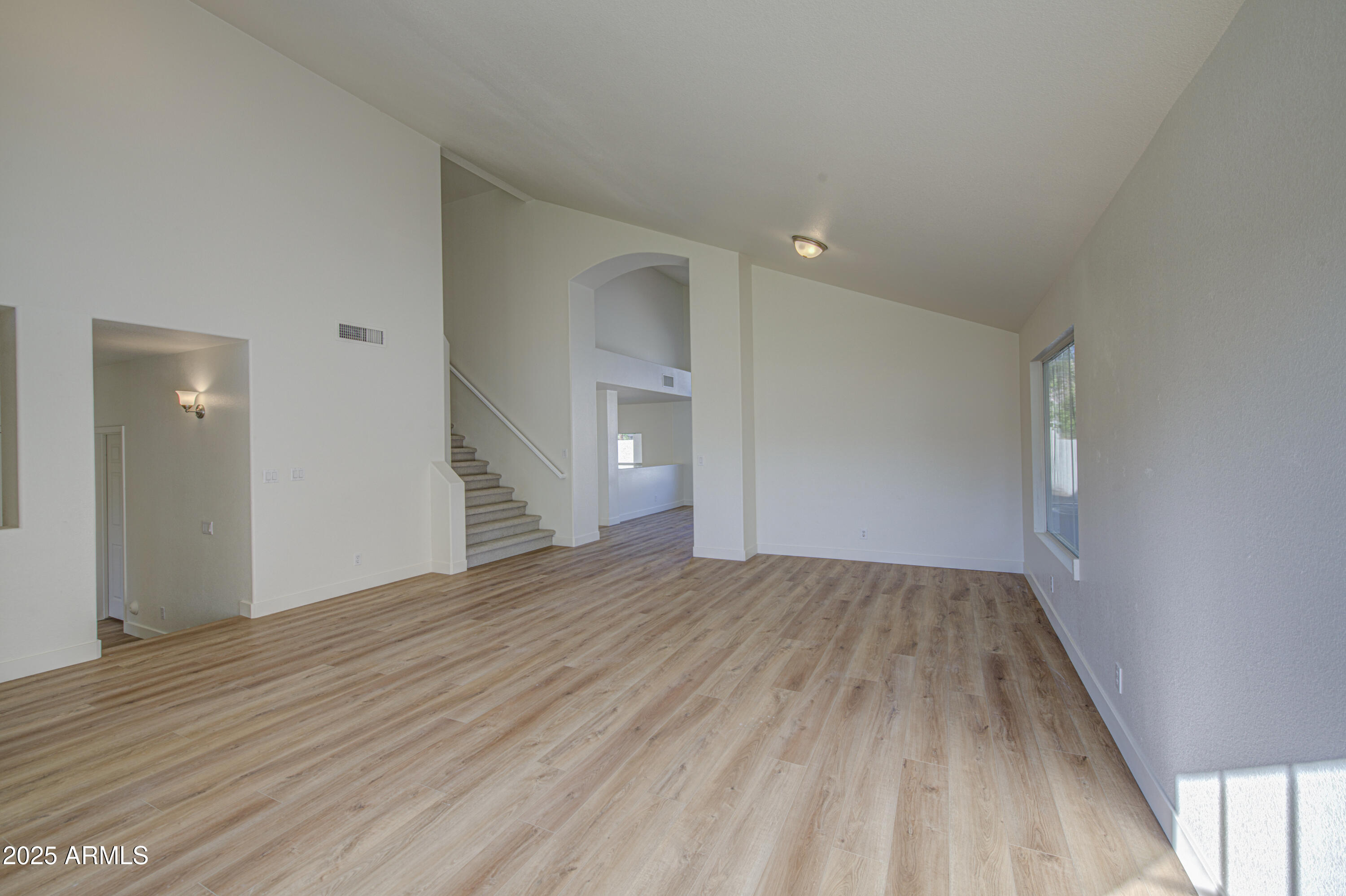 4266 East Millbrae Lane Gilbert, AZ 85234 - Photo 7 of 53 wooden floor in an empty room with a window