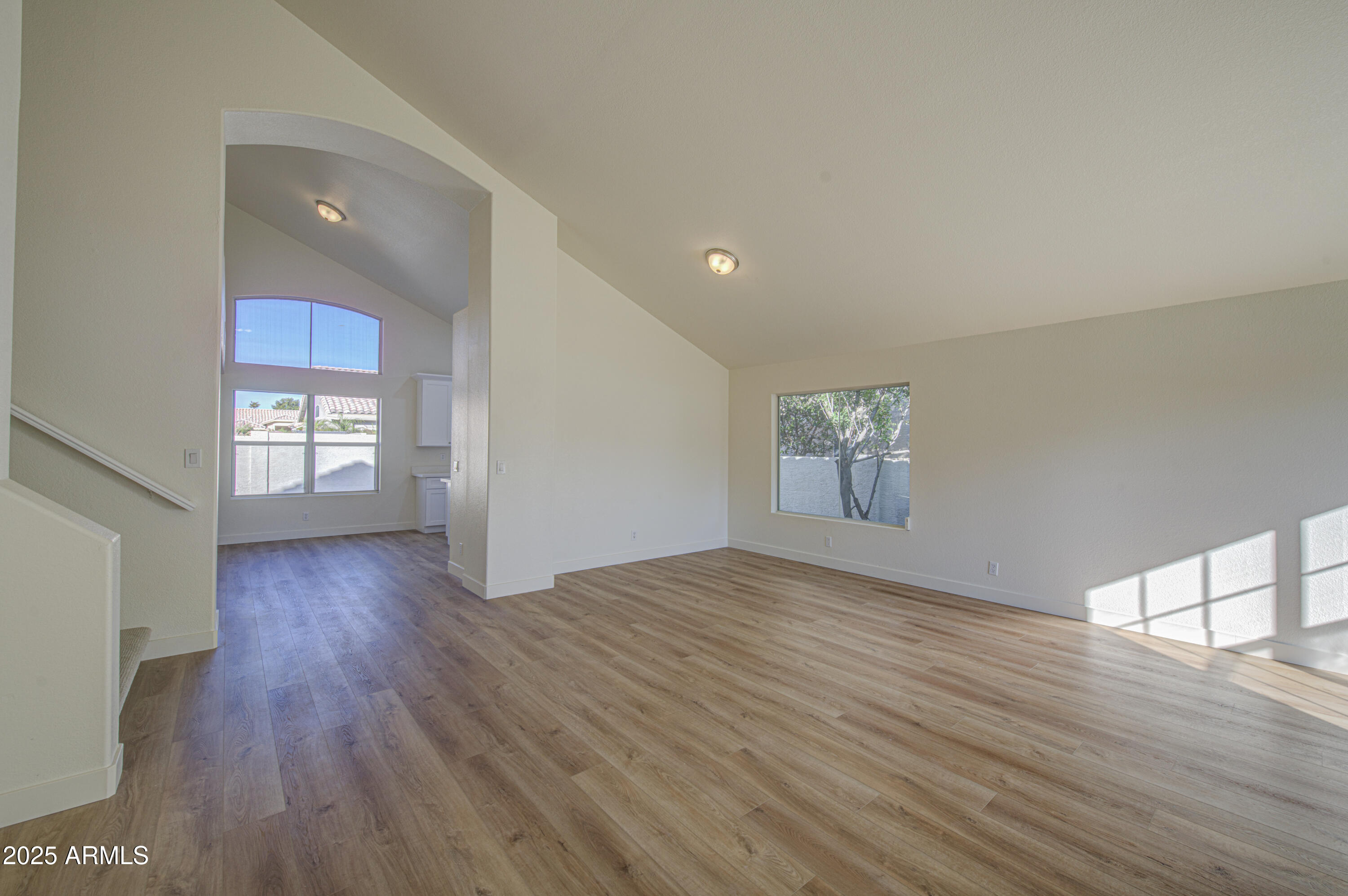 4266 East Millbrae Lane Gilbert, AZ 85234 - Photo 8 of 53 a view of livingroom with hardwood floor and hallway