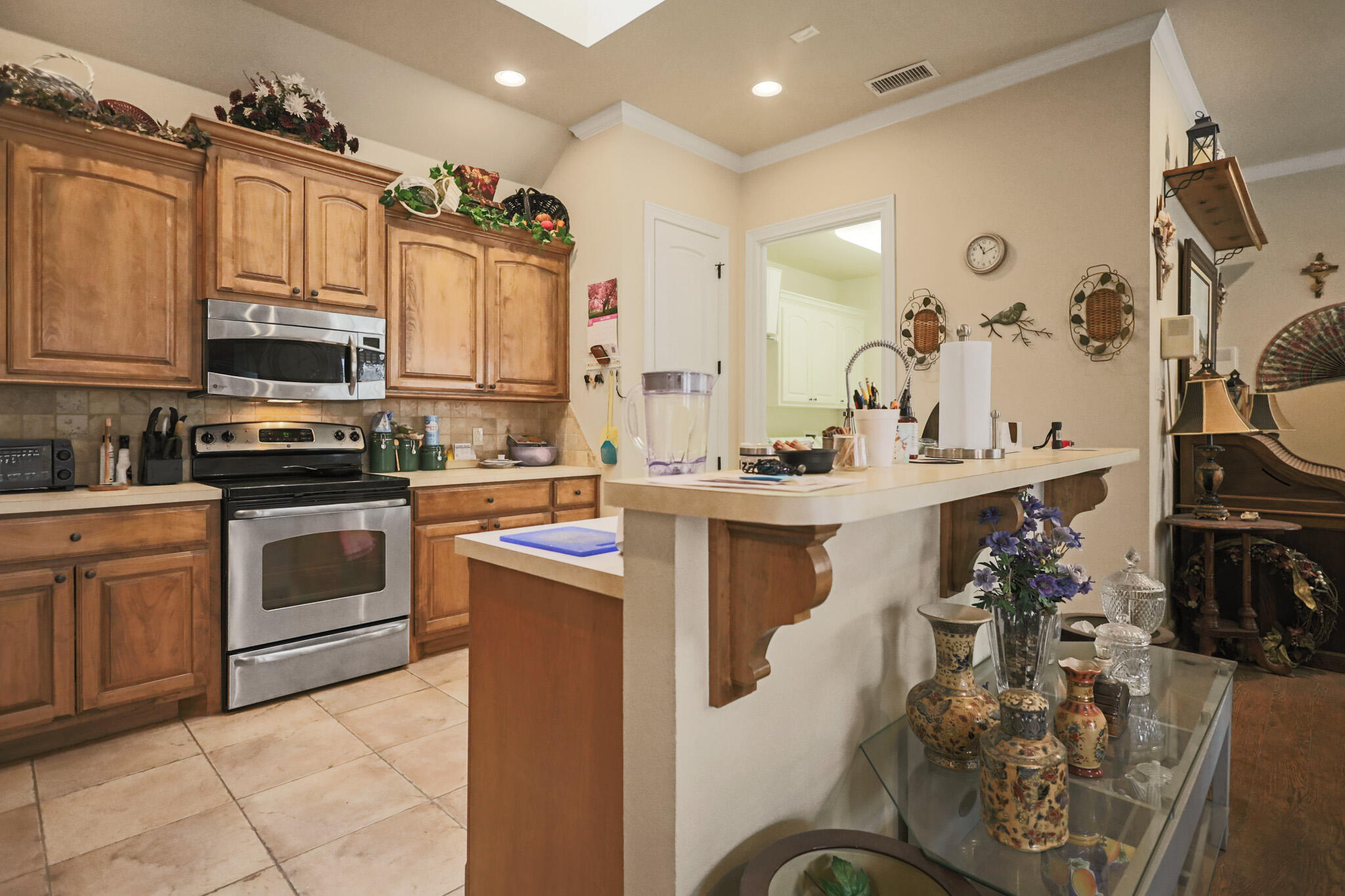 73 Windsor Court Lubbock, TX 79416 - Photo 12 of 34 a kitchen with cabinets a sink and appliances