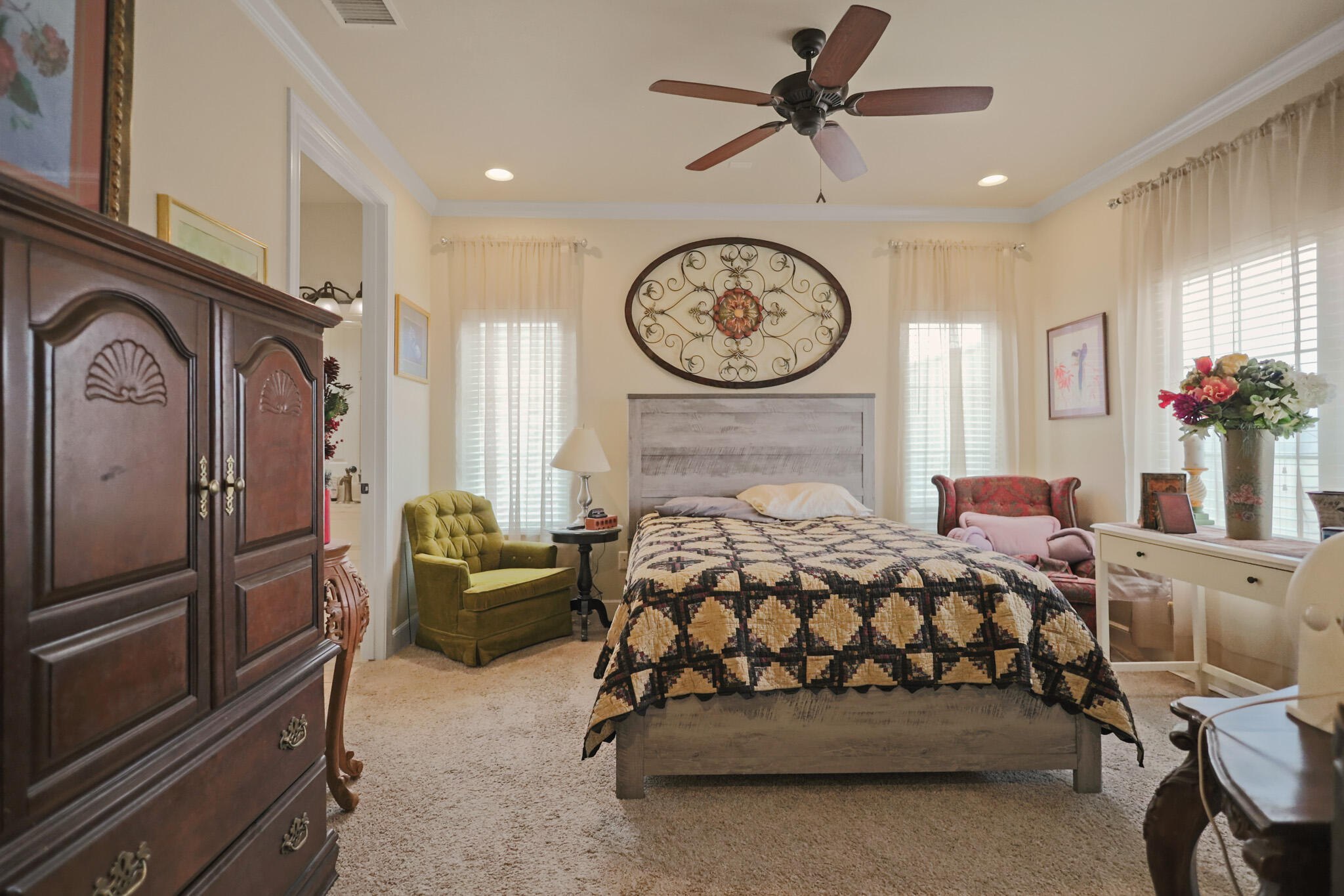73 Windsor Court Lubbock, TX 79416 - Photo 20 of 34 a bedroom with a bed next to a window with the dresser