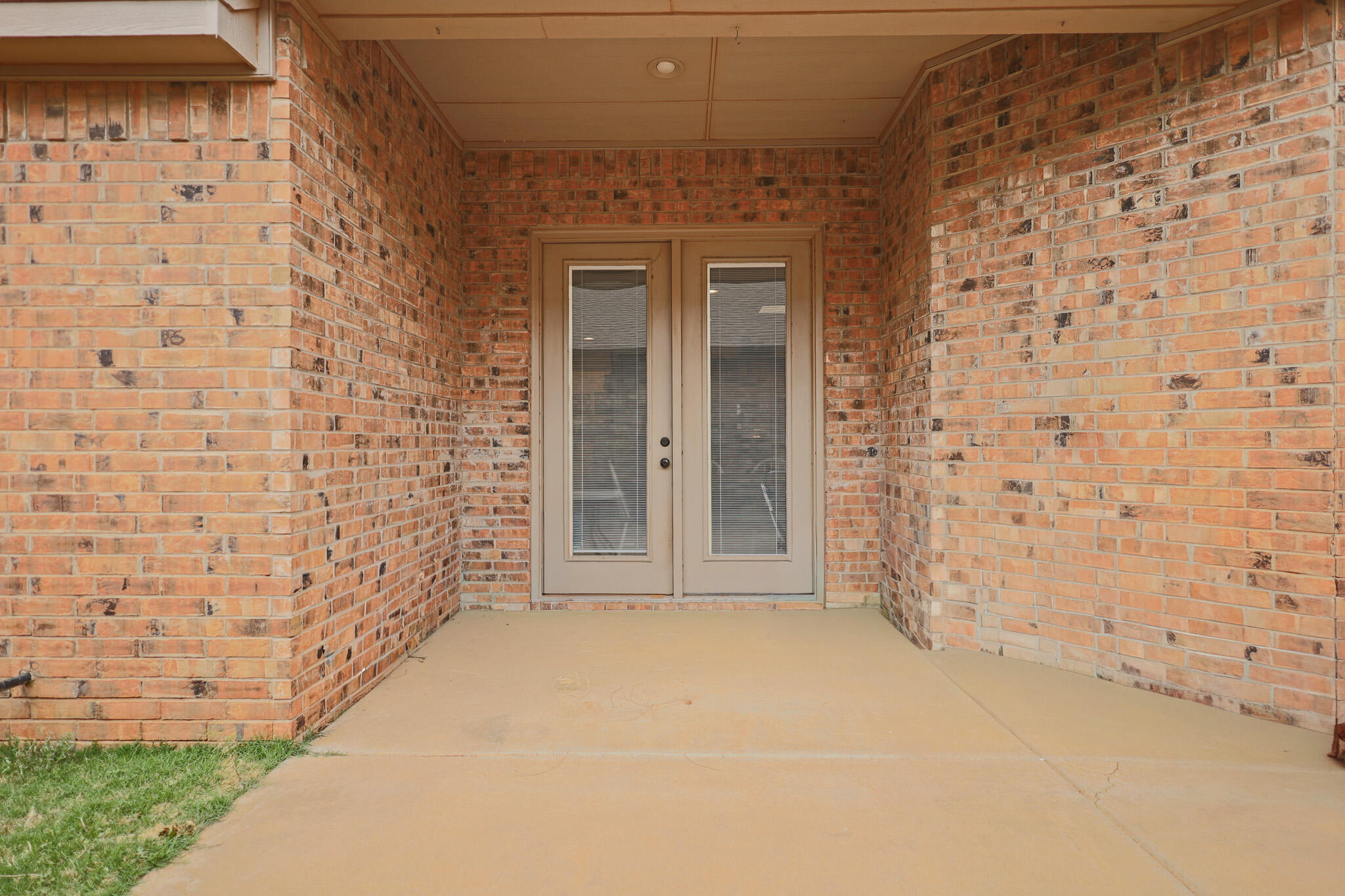 73 Windsor Court Lubbock, TX 79416 - Photo 30 of 34 a view of empty room with brick walls