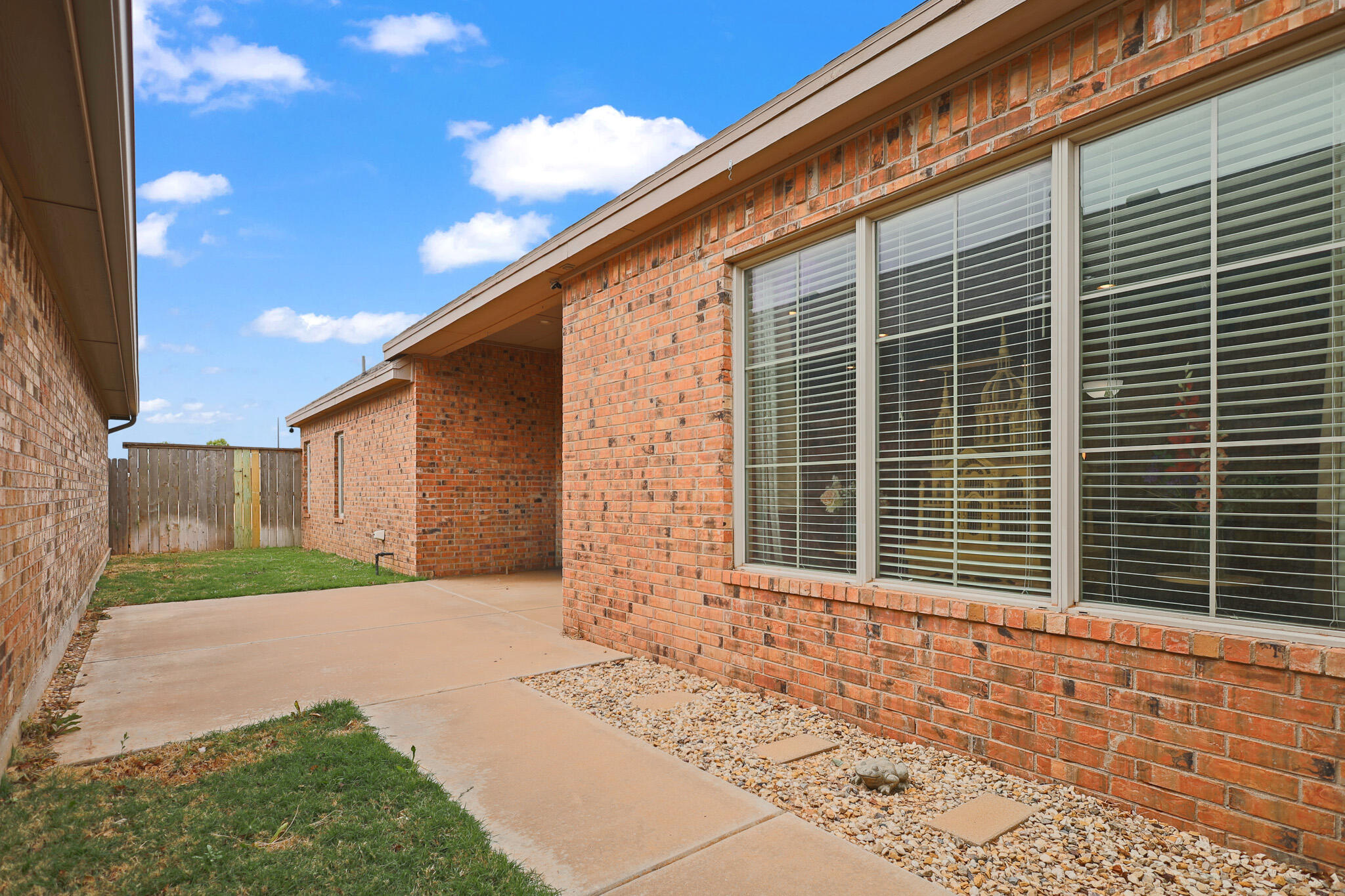 73 Windsor Court Lubbock, TX 79416 - Photo 31 of 34 a front view of a house with a yard