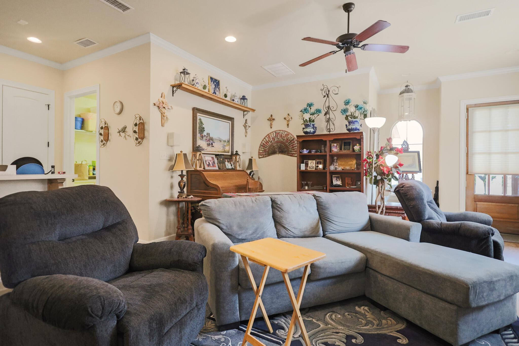 73 Windsor Court Lubbock, TX 79416 - Photo 6 of 34 a living room with furniture a chandelier and a flat screen tv