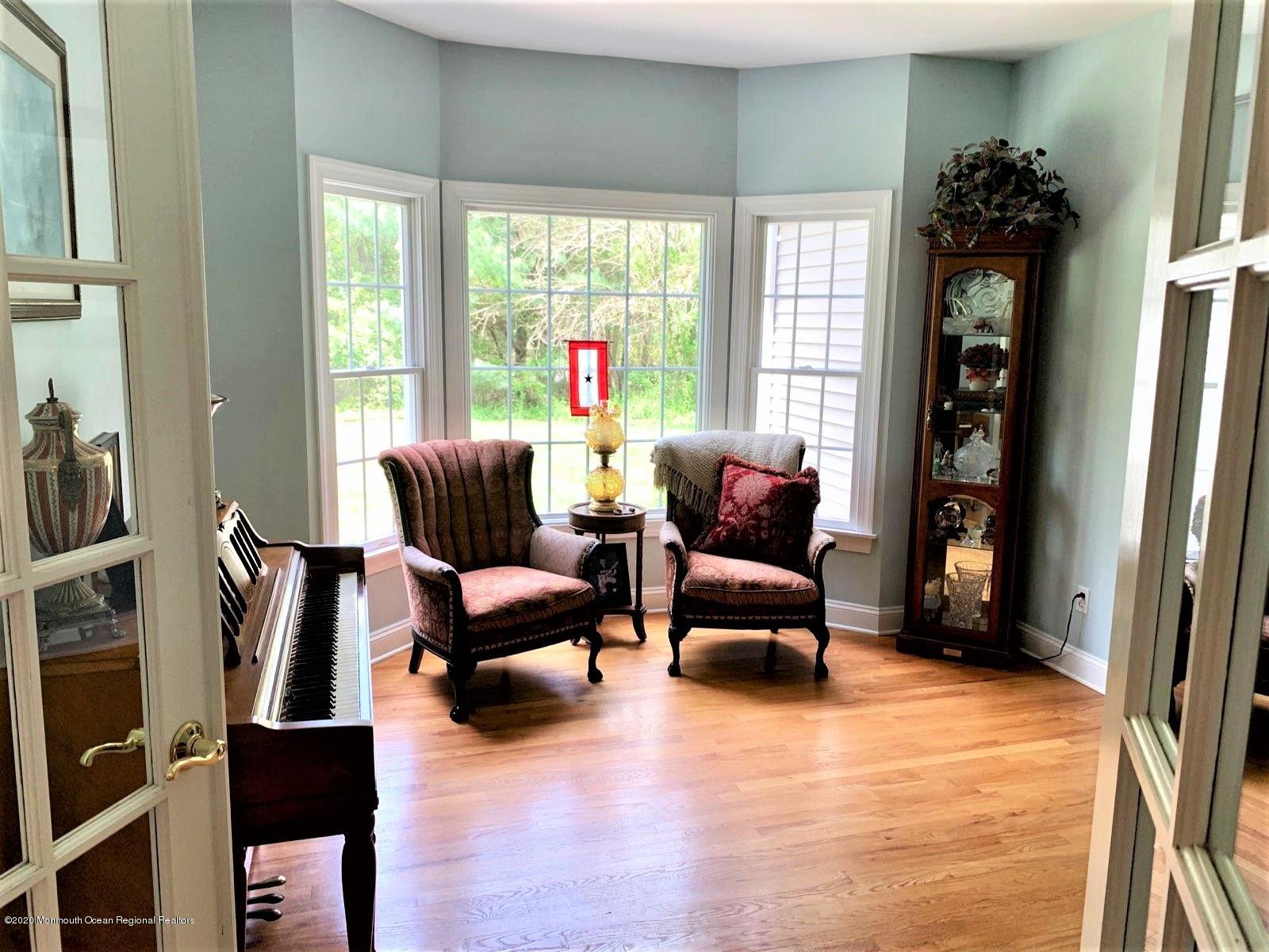 717 Fort Plains Road Howell, NJ 07731 - Photo 12 of 30 a living room with furniture and a large window