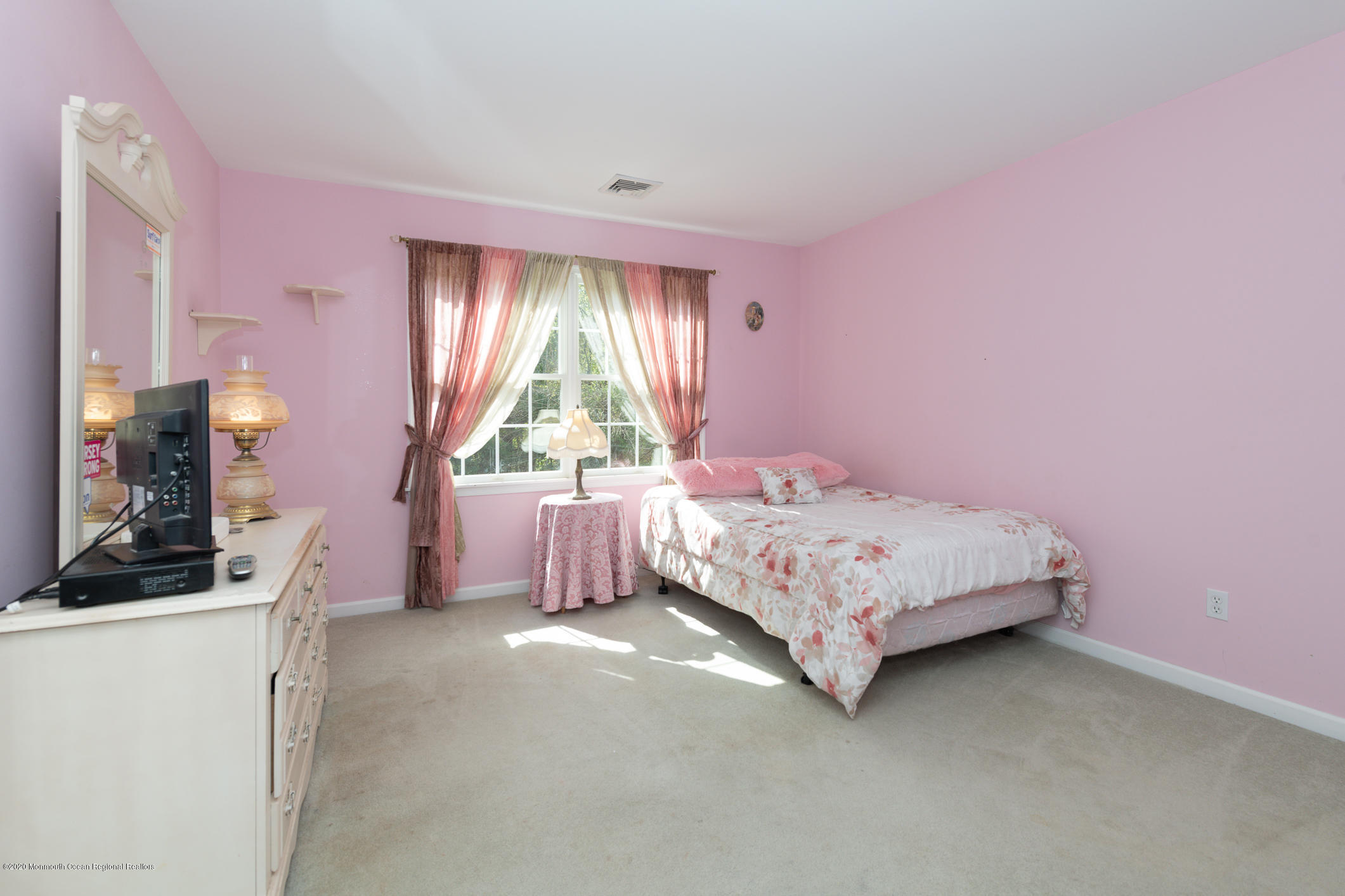 717 Fort Plains Road Howell, NJ 07731 - Photo 19 of 30 a bedroom with a bed and a dresser