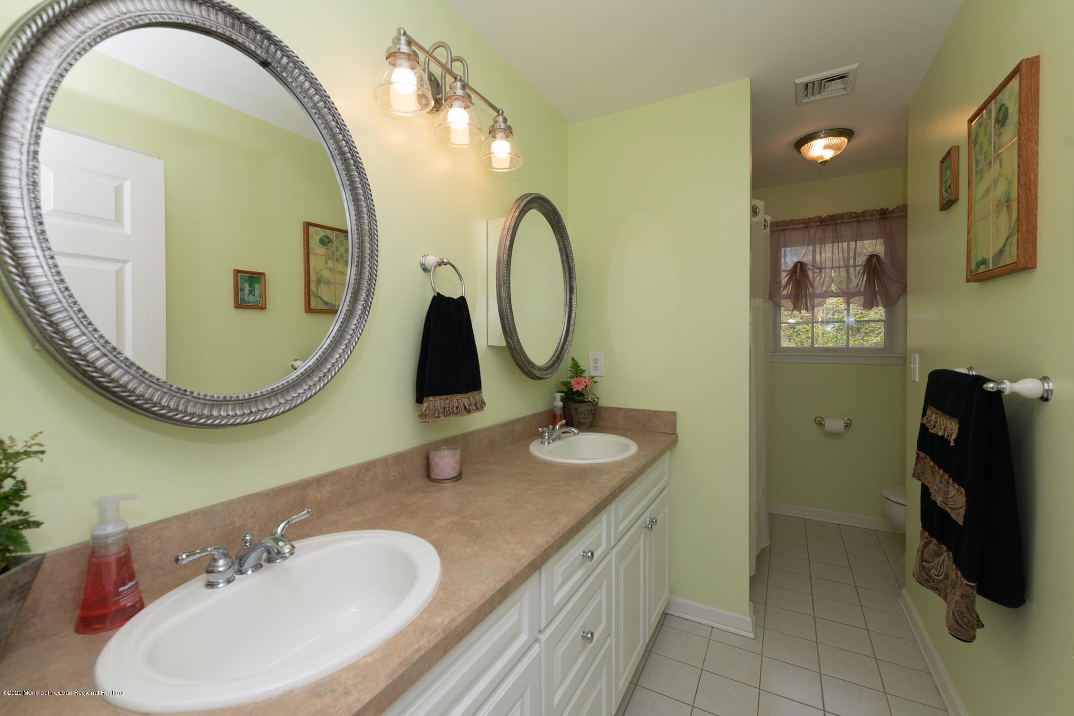 717 Fort Plains Road Howell, NJ 07731 - Photo 20 of 30 a bathroom with a granite countertop double vanity mirror and a mirror