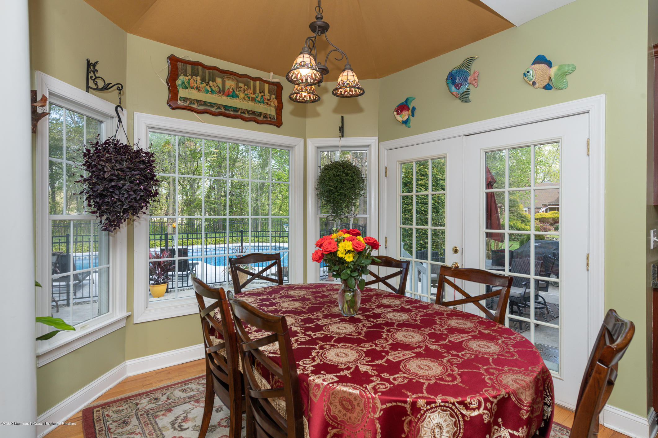 717 Fort Plains Road Howell, NJ 07731 - Photo 10 of 30 a view of a dining room with furniture large windows and wooden floor