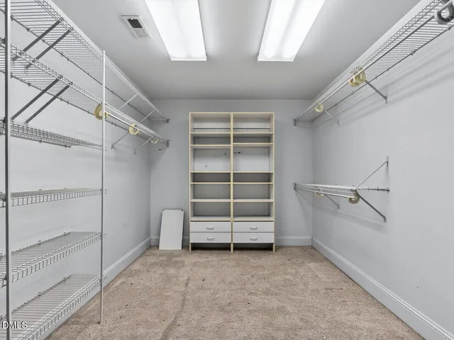 a view of an empty walk in closet