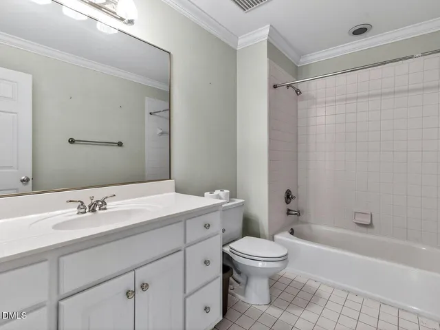 a bathroom with a sink a toilet a mirror a bathtub and shower