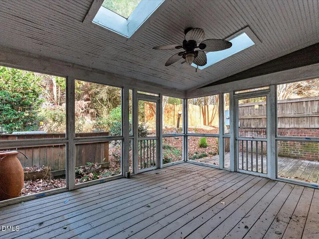 a view of a deck with wooden floor and outdoor space