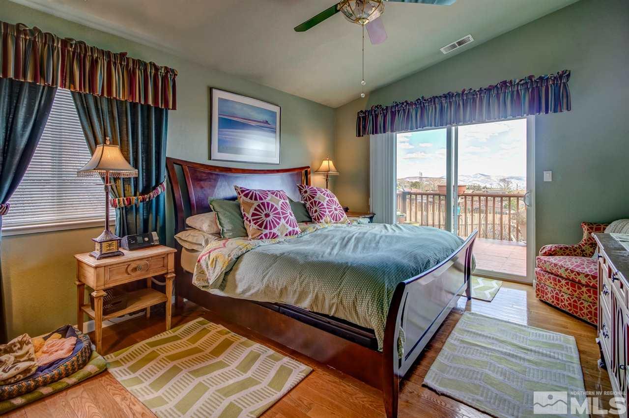 712 Talus Way Reno, NV 89503 - Photo 11 of 25 a bed sitting in a bedroom next to a window