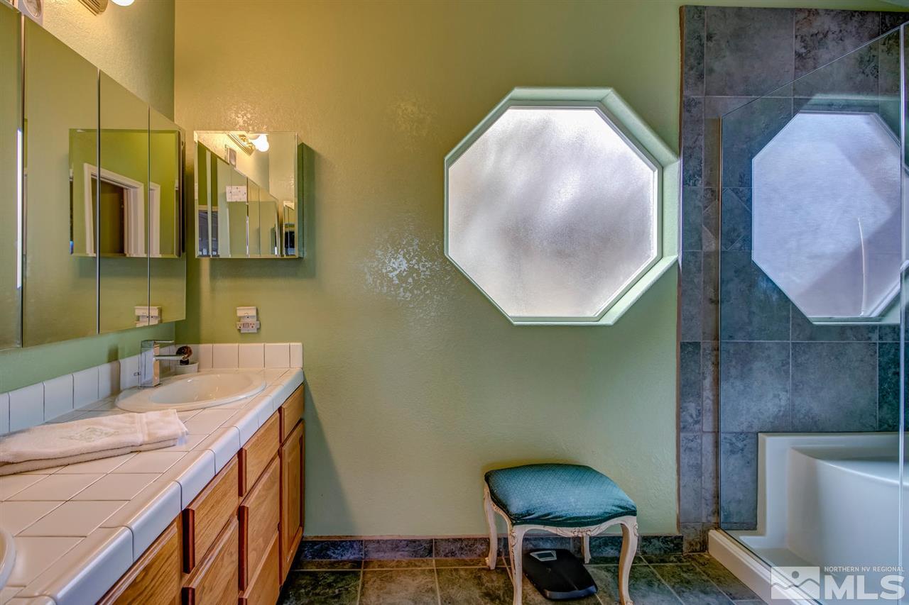 712 Talus Way Reno, NV 89503 - Photo 13 of 25 a bathroom with a sink and a mirror