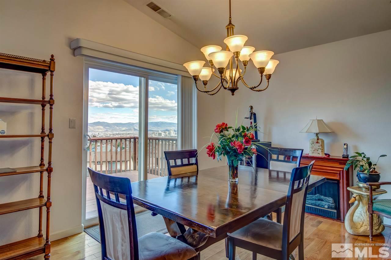 712 Talus Way Reno, NV 89503 - Photo 14 of 25 a view of a dining room with furniture a chandelier and wooden floor