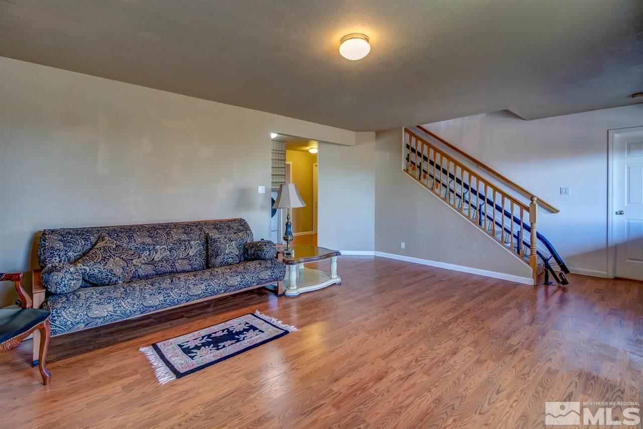 712 Talus Way Reno, NV 89503 - Photo 20 of 25 a living room with furniture and a wooden floor