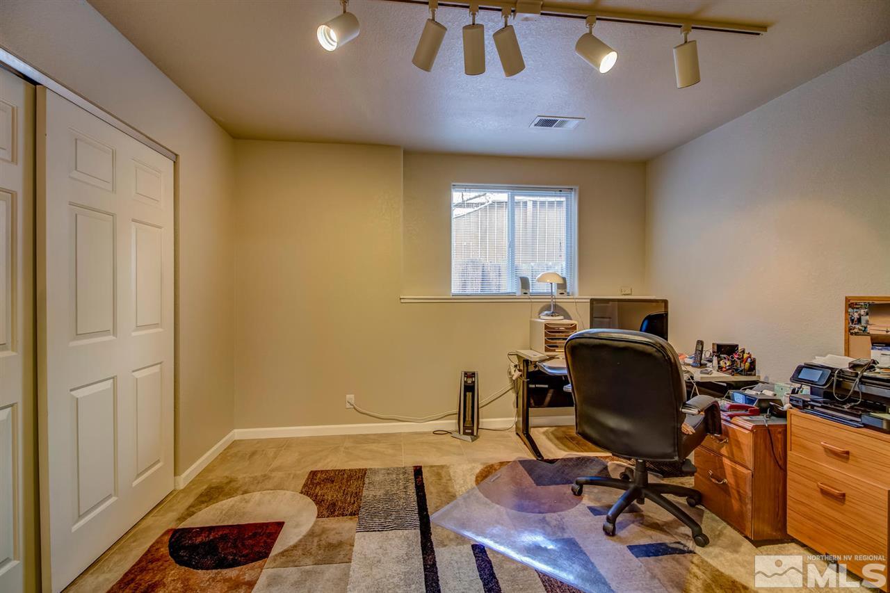 712 Talus Way Reno, NV 89503 - Photo 23 of 25 a view of a workspace with furniture and a window