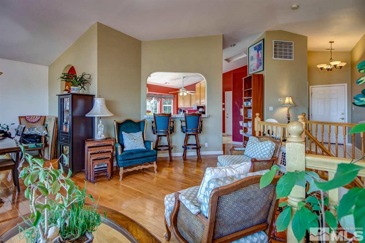 712 Talus Way Reno, NV 89503 - Photo 4 of 25 a living room with furniture and a dining table
