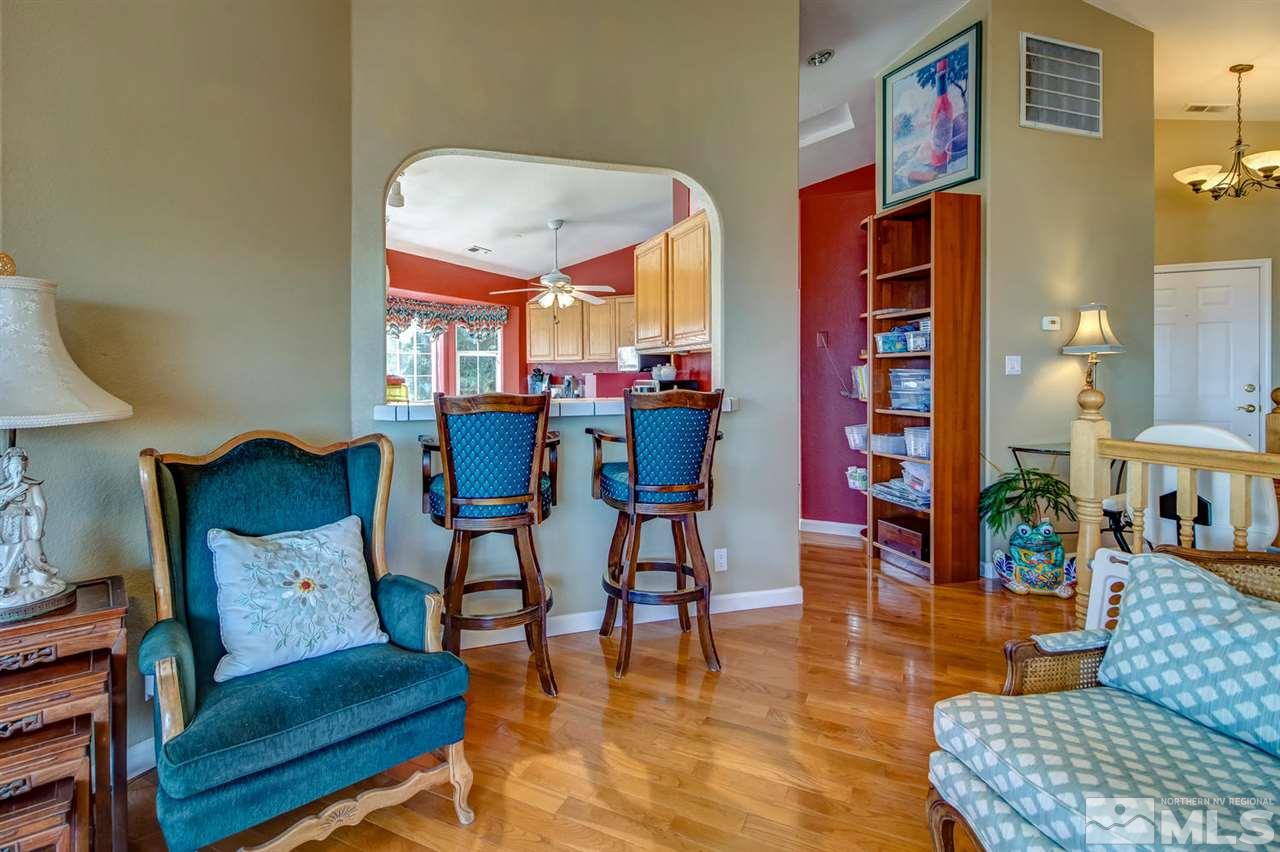 712 Talus Way Reno, NV 89503 - Photo 6 of 25 a living room with furniture and a dining table with rug