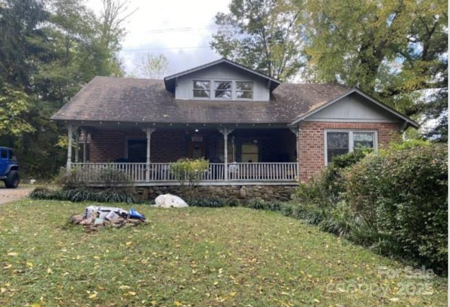 298 Speedwell Road Cullowhee, NC 28723 - Photo 1 of 20 a front view of a house with garden