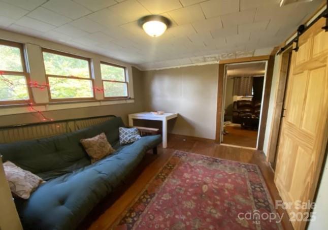 298 Speedwell Road Cullowhee, NC 28723 - Photo 12 of 20 a living room with furniture and a window