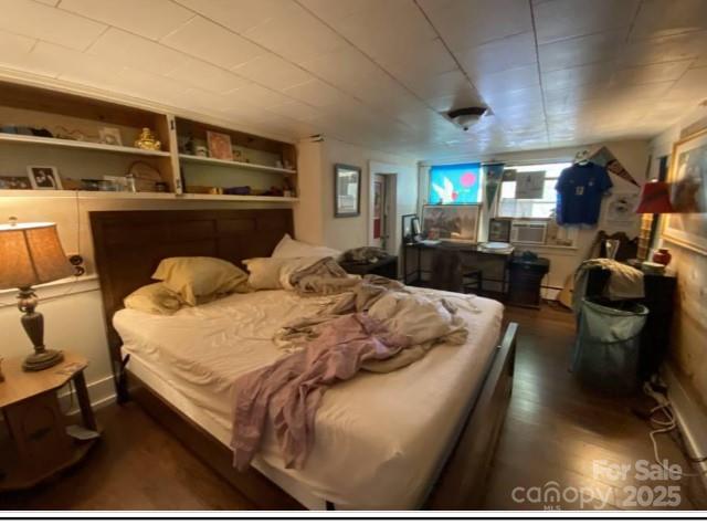 298 Speedwell Road Cullowhee, NC 28723 - Photo 13 of 20 a bed sitting in a bedroom next to a window