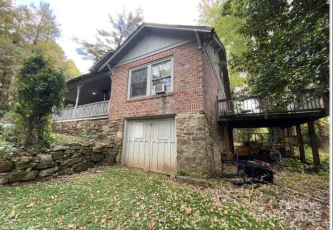 298 Speedwell Road Cullowhee, NC 28723 - Photo 16 of 20 a front view of a house with garden