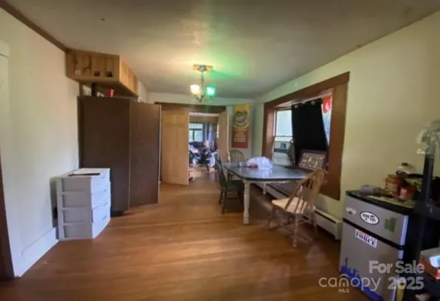 a view of a livingroom with furniture and a flat screen tv