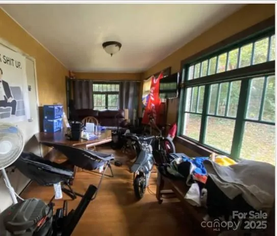 a room with gym equipment and a large window