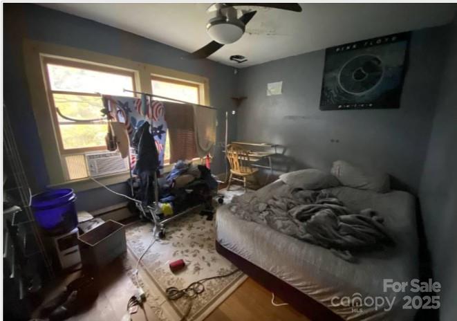 298 Speedwell Road Cullowhee, NC 28723 - Photo 10 of 20 a bedroom with furniture and a window