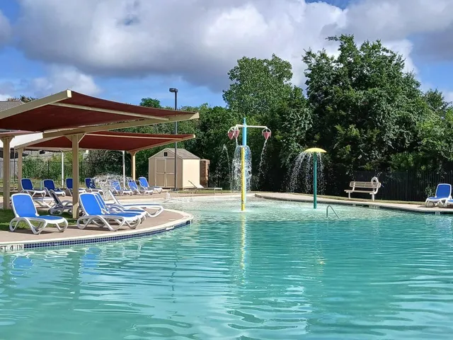 a view of a swimming pool with a patio