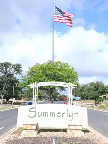 a view of a street with a building in the background