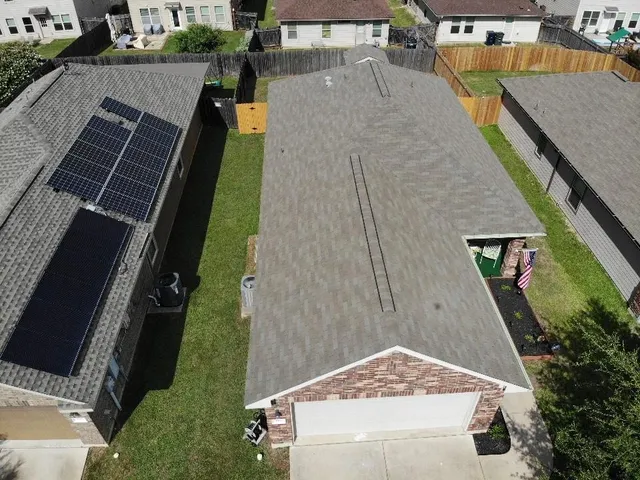 an aerial view of residential houses with outdoor space
