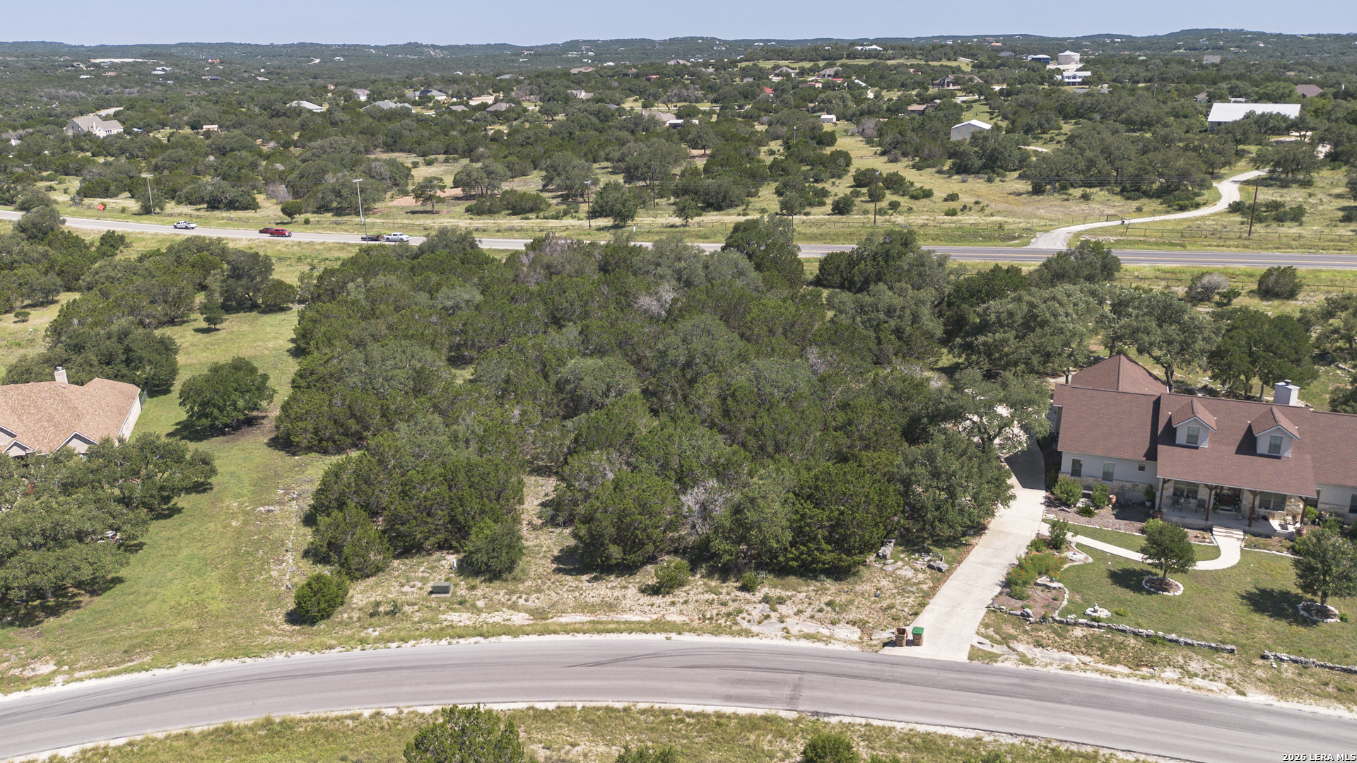 129 Blackbird Drive Spring Branch, TX 78070 - Photo 2 of 16 an aerial view of residential houses with outdoor space and trees