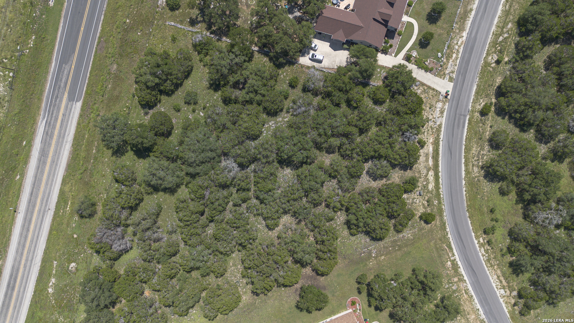 129 Blackbird Drive Spring Branch, TX 78070 - Photo 3 of 16 a view of a forest with a houses