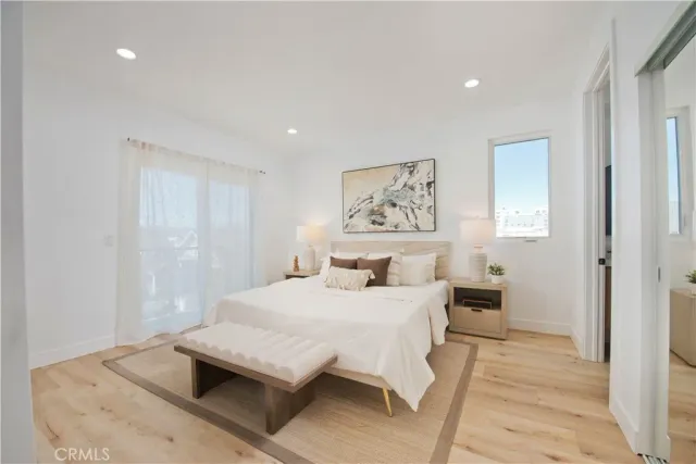 a bedroom with a bed and a table