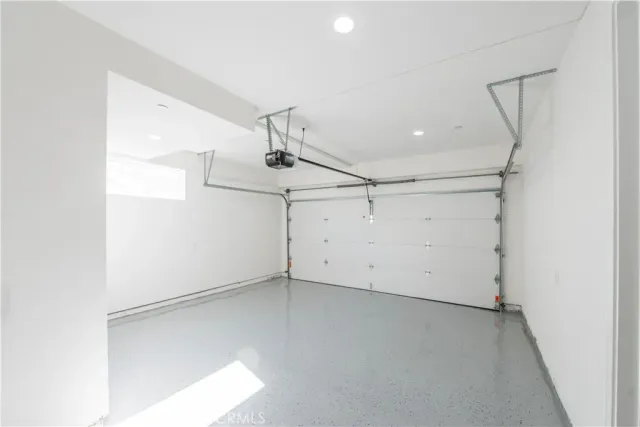 an empty room with a ceiling fan and wooden floor